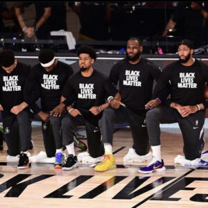 Members of the Los Angles Lakers kneeling during the national anthem in the NBA Bubble