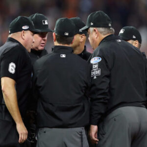 MLB Umpires huddled to discuss a play