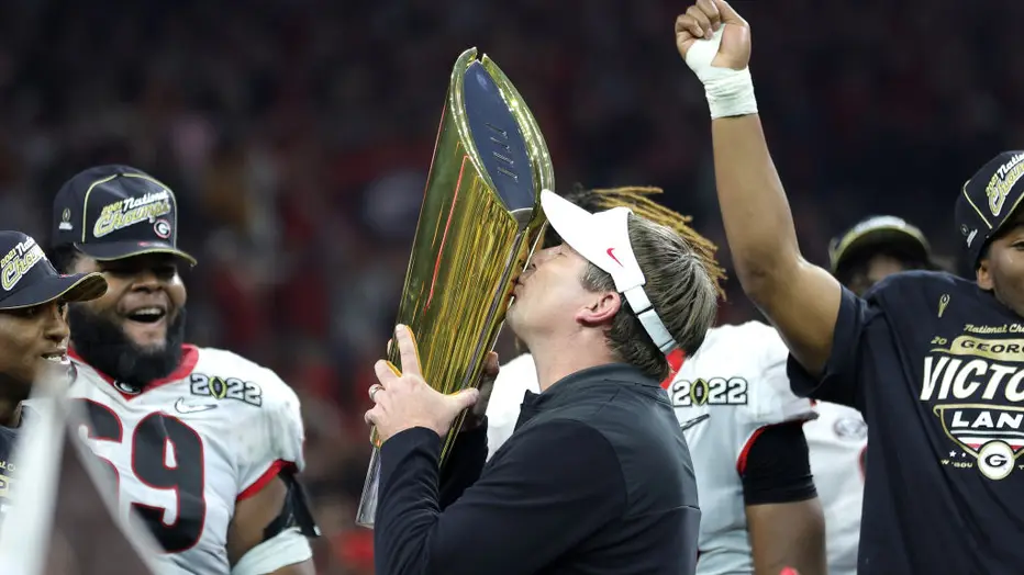 Kirby Smart holding the National Championship trophy
