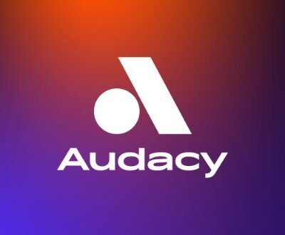Orange and purple gradient background with Audacy logo